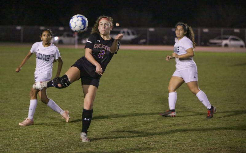 Columbia’s Ember Russell-Martinez gathers possession of the ball against Suwannee on Thursday night. (BRENT KUYKENDALL/Lake City Reporter)