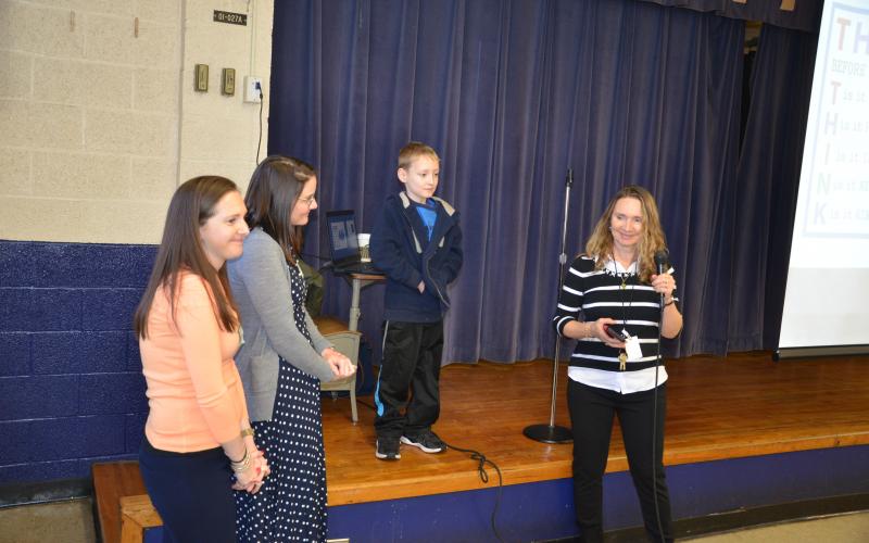 Hunter is invited to stand in front of a group of students after representatives from the Shriners gave an update on his recovery. Hunter spent months at a Shriners hospital in Massachusetts. (CARL MCKINNEY/Lake City Reporter)