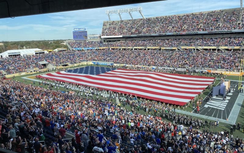An American flag is stretched across the field at Camping World Stadium for the national anthem at the Pro Bowl on Sunday, in Orlando. (MICHAEL BJORKLUND-MALCOM/Special to the Reporter)