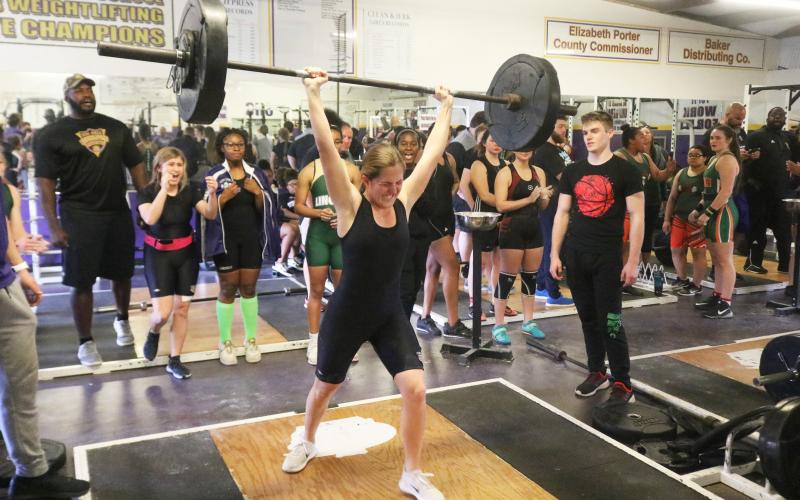 Columbia’s Morgan Hoyle finishes her clean and jerk to break her own school record in the 129-pound weight class with a lift of 145 pounds at the District 2-2A meet on Friday. (JORDAN KROEGER/Lake City Reporter)