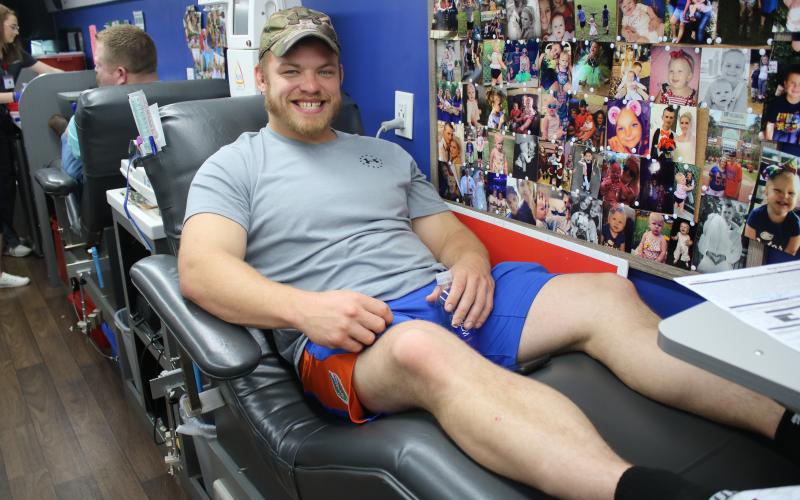 Nick Albrecht takes time off from his job at the Florida Department of Transportation to donate blood at the Lake City Police Department’s “Public Safety Blood Drive” on Friday. (MICHAEL PHILIPS/Lake City Reporter)