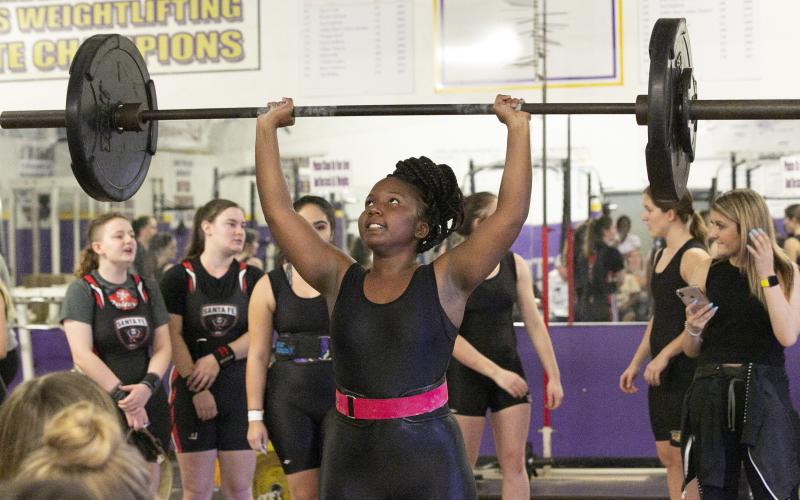 Columbia weightlifter Miracle Rentz-Black finishes her clean and jerk during Thursday’s meet against Santa Fe. (JEN CHASTEEN/Special to the Reporter) 