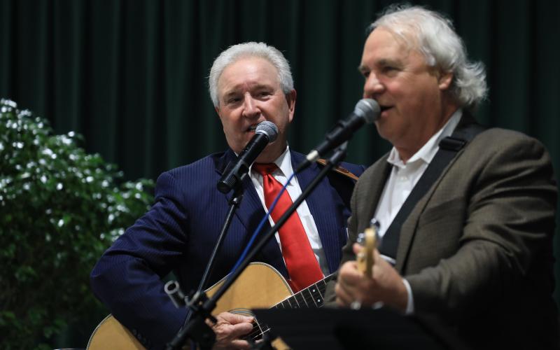 Retired Circuit Judge Vernon Douglas, left, who served as master of ceremonies, also joined the band for a few numbers. (CAMERON VINING/Special to the Reporter)