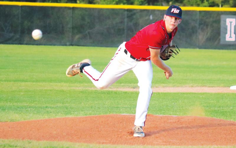 Fort White pitcher Tyler Shelnut throws to a batter in a game last season. (FILE)