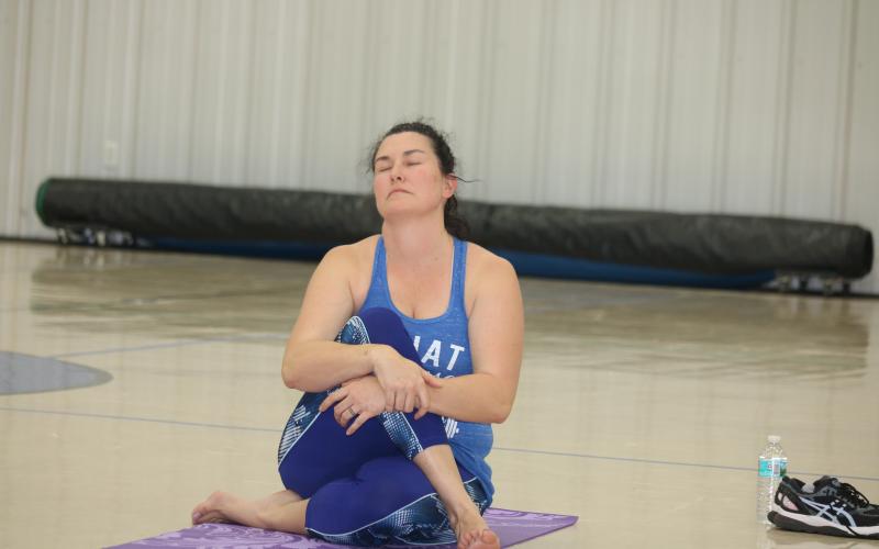 Amy Gasparrini meditates during a yoga session for school district employees Tuesday afternoon at the Parkview Baptist Church gym. (TONY BRITT/Lake City Reporter)