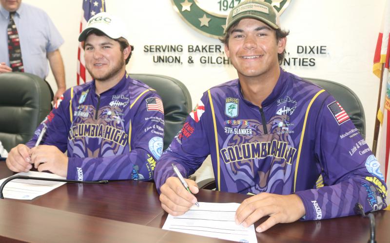 Columbia Bassmasters Jackson Swisher (left) and Seth Slanker (right) signed their letters of intent to compete with Florida Gateway College on Thursday. (TONY BRITT/Lake City Reporter)