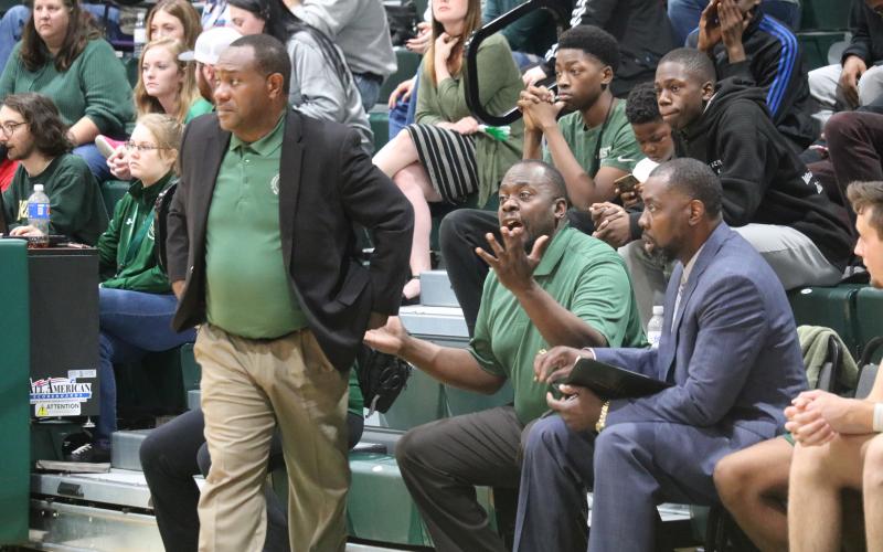 FGC assistant coach C.C. Wilson calls out to his players as head coach Charles Ruise looks on during Saturday's Division II Region 8 championship against Pasco-Hernando State College. (JORDAN KROEGER/Lake City Reporter)