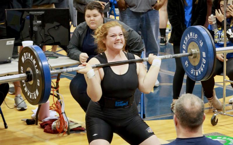 Columbia weightlifter Reece Chasteen lifts the bar during her clean and jerk at the Class 2A state meet on Saturday. (JEN CHASTEEN/Special to the Reporter)