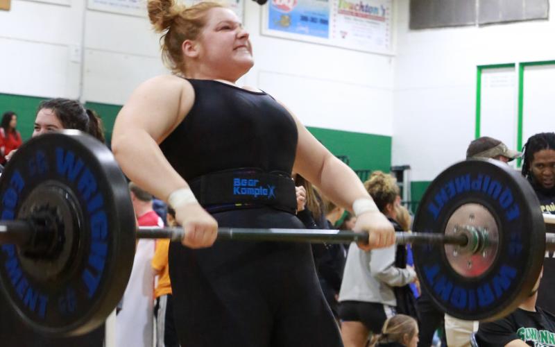 Columbia weightlifter Reece Chasteen lifts the bar during her clean and jerk at the Region 1-2A Meet on Saturday. (JEN CHASTEEN/Special to the Reporter)