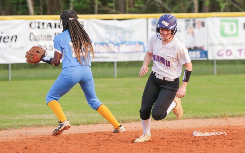 Columbia third baseman Morgan Hoyle rounds second base and heads to third on one of her two triples in Tuesday’s game against Chiefland. (BRENT KUYKENDALL/Lake City Reporter)