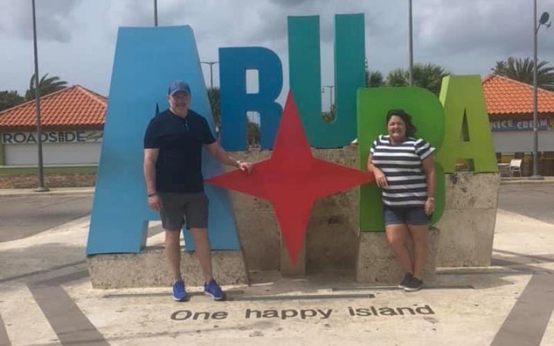 Lake City residents Ovidiu and Sondra Deaconescu pose for a picture in Aruba while on a cruise. Their trip was unexpectedly extended yesterday, when Puerto Rican officials refused to let passengers from the ship disembark. (COURTESY)