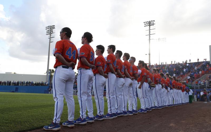Florida's baseball team stands for the national anthem prior to Tuesday's game against Florida State, in Gainesville. (AAU COMMUNICATIONS)