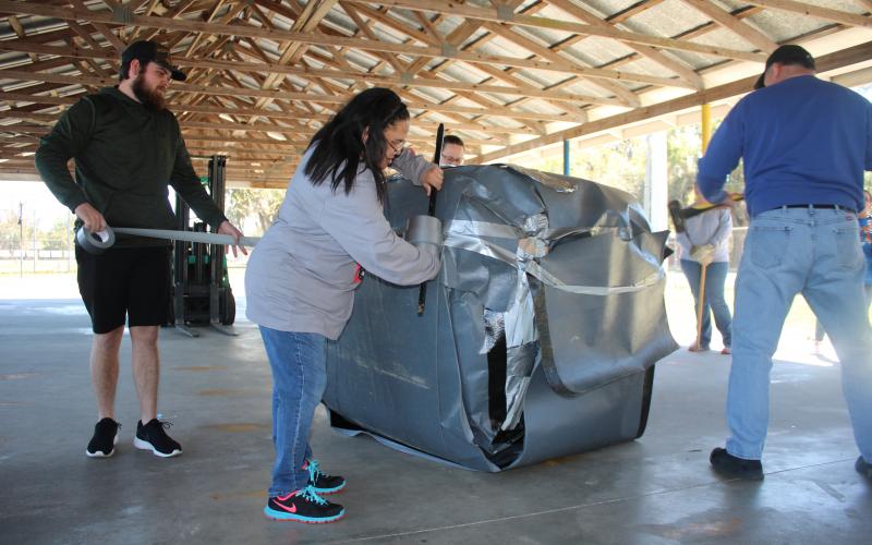 Eastside Parents, students and staff spent hours wrapping tape around what became the heaviest known ball of tape in the world. Beneath the masking tape and duct tape, wide swaths of roofing tape can be seen covering the ball. (AMY HIETT/Special to the Reporter)