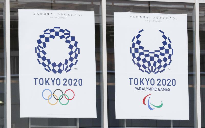 Logos of Tokyo 2020 Olympic and Paralympic Games (Tokyo 2020) on display outside Tokyo Sports Square building on March 23. (RODRIGO REYES MARIN/Zuma Press/TNS)