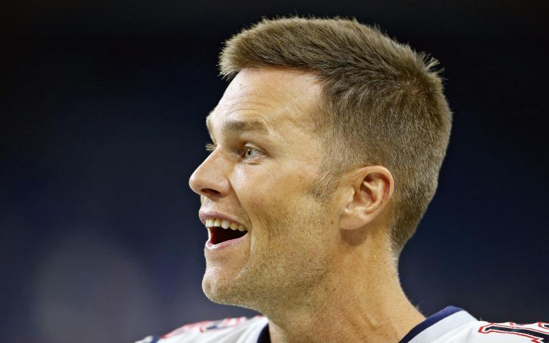New England Patriots quarterback Tom Brady (12) smiles as he walks off the field before their preseason game against the Detroit Lions at Ford Field in Detroit, on Aug. 8, 2019. (MIKE MULHOLLAND/TNS)