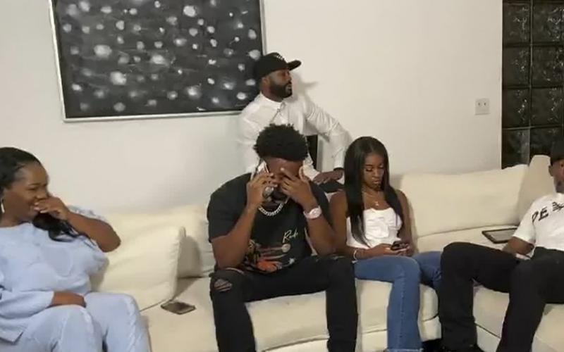 In this still image from video provided by the NFL, CJ Henderson talks on the phone during the NFL draft on Thursday. The Jacksonville Jaguars selected Henderson in the first round of the NFL draft. (NFL)