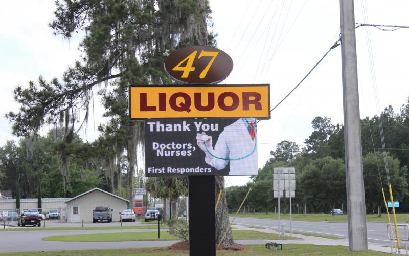 The electronic sign at 47 Liquor, 563 SW SR 47, Lake City, shows a message thanking doctors and first responders for their actions during the Covid-19 pandemic. Danny Patel, owner of the store, said he wanted to do something to thank the medical professionals and first responders working every day. “They are the true heroes,” he said. Sales have spiked at Patel’s store as well in recent weeks. (TODD WILSON/Lake City Reporter)