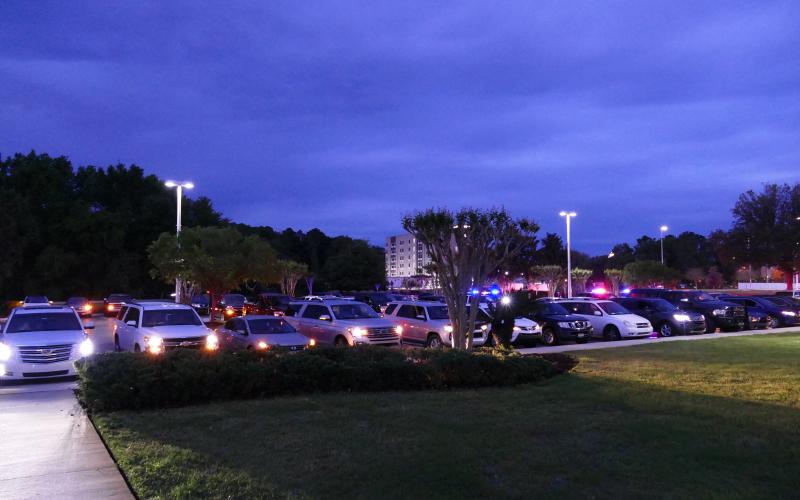 Vehicles line up for the drive-in vigil Sunday night. (TRAVIS LEE/Special to the Reporter)