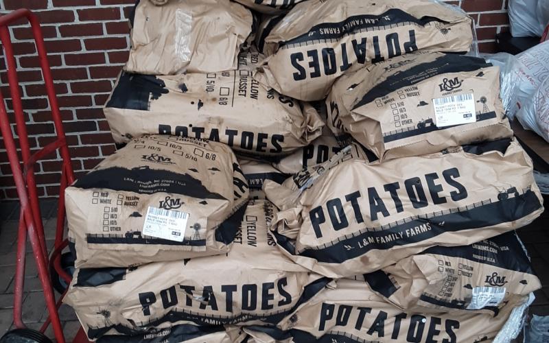 Bags of potatoes and more were available to Columbia County families in need by way of the Worship Room. (TOM NOTON/Special to the Reporter)