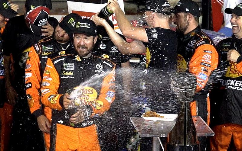 NASCAR driver Martin Truex Jr. celebrates winning the Coca-Cola 600 with his team at Charlotte Motor Speedway on may 26, 2019, in Concord, N.C. (JEFF SINER/Charlotte Observer/TNS)