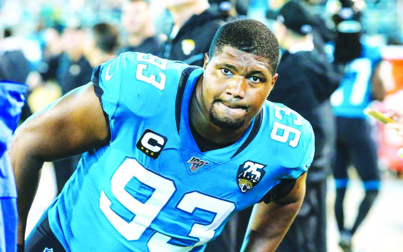 Jacksonville Jaguars defensive end Calais Campbell (93) stretches before against the Tennessee Titans at TIAA Bank Field last season, in Jacksonville. (TRIBUNE NEWS SERVICE)