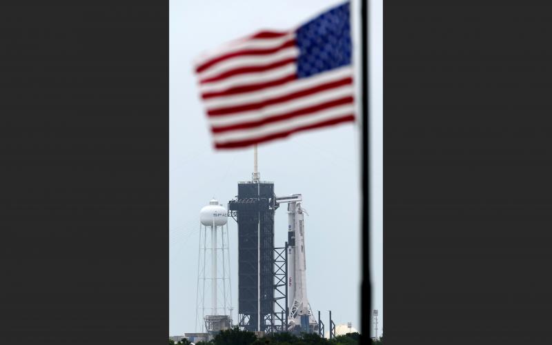The SpaceX Falcon 9, with the Crew Dragon spacecraft on top of the rocket, sits on Launch Pad 39-A on Monday at Kennedy Space Center. Two astronauts will fly on the SpaceX Demo-2 mission to the International Space Station scheduled for launch on Wednesday. (DAVID J. PHILLIP/AP Photo)