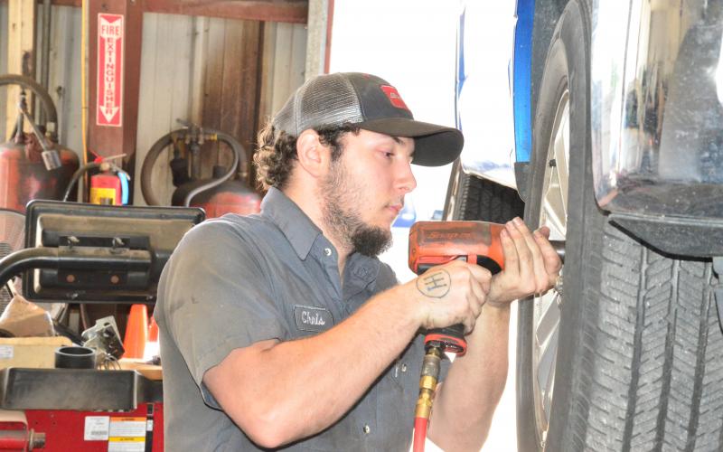 Chris Shillito gets to work at Tire Mart of Lake City in late April. Business was slow then but has since ramped back up as cars return to the road. (CARL MCKINNEY/Lake City Reporter)