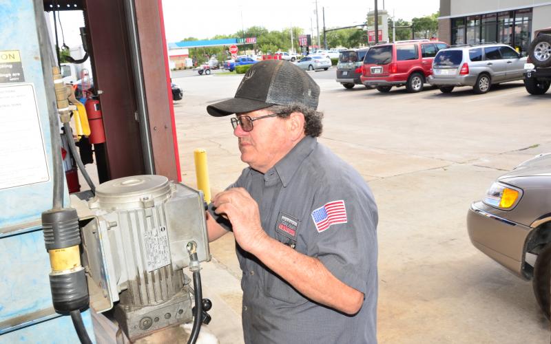 Ricky Kinard services a vehicle. Since the state started reopening in early May, there’s been an influx of customers that may put the tire store on track to do even better business than last year, a co-owner says. (CARL MCKINNEY/Lake City Reporter)