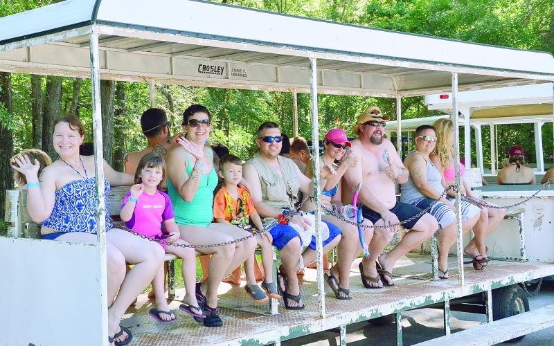 Guests ride the tram at Ichetucknee Springs in May 2016. The north entrance is closed, but the south entrance opened Wednesday. (CARL MCKINNEY/Lake City Reporter)