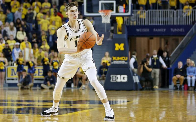 Michigan sophomore Colin Castleton is transferring to Florida. (MIKE MULHOLLAND/TNS)