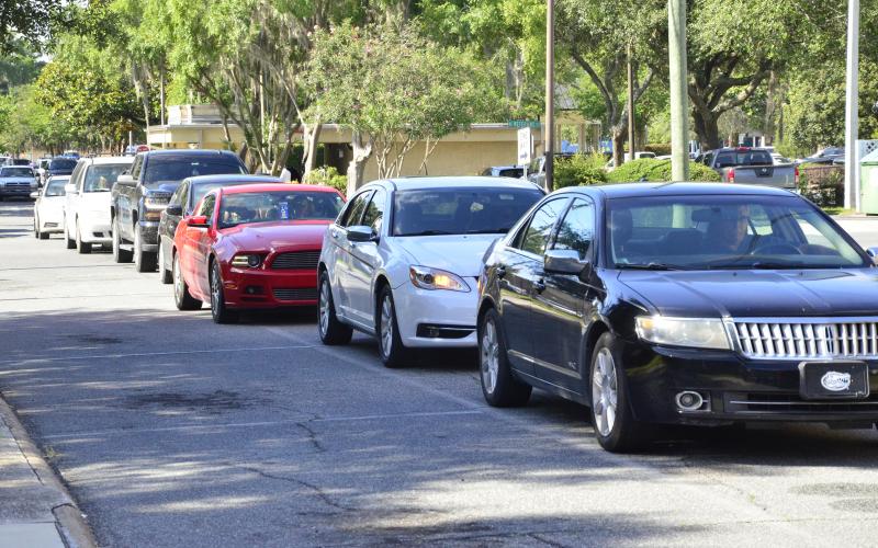 Traffic stretches from Wilson Park almost to the courthouse, marking the first time tests have been available to all. (CARL MCKINNEY/Lake City Reporter)