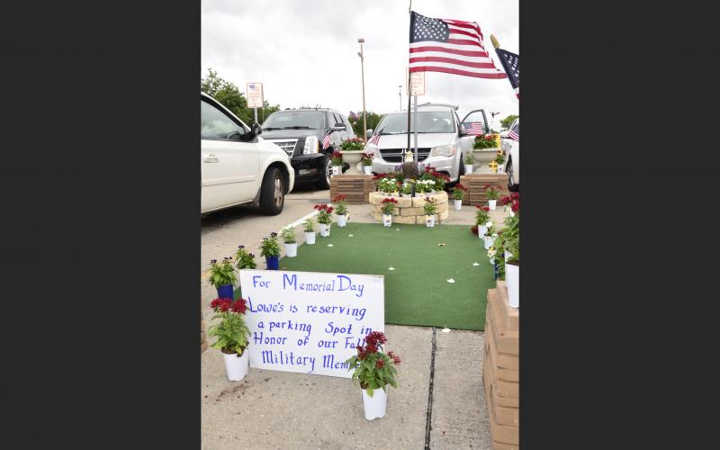 A parking space at the Lake City Lowe’s is set aside for fallen service members on Monday.  (CARL MCKINNEY/Lake City Reporter)