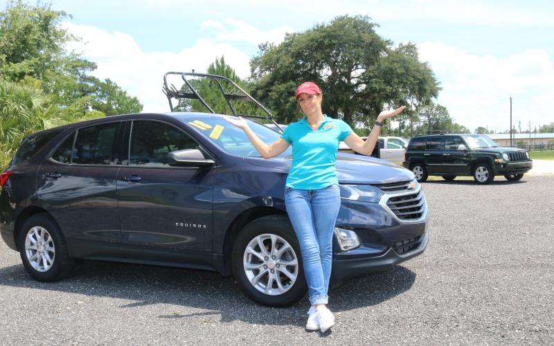Jennifer Williamson, owner of Right Way Automotive, is down to a handful of vehicles to sell, with little hope of getting more anytime soon. (TONY BRITT/Lake City Reporter)