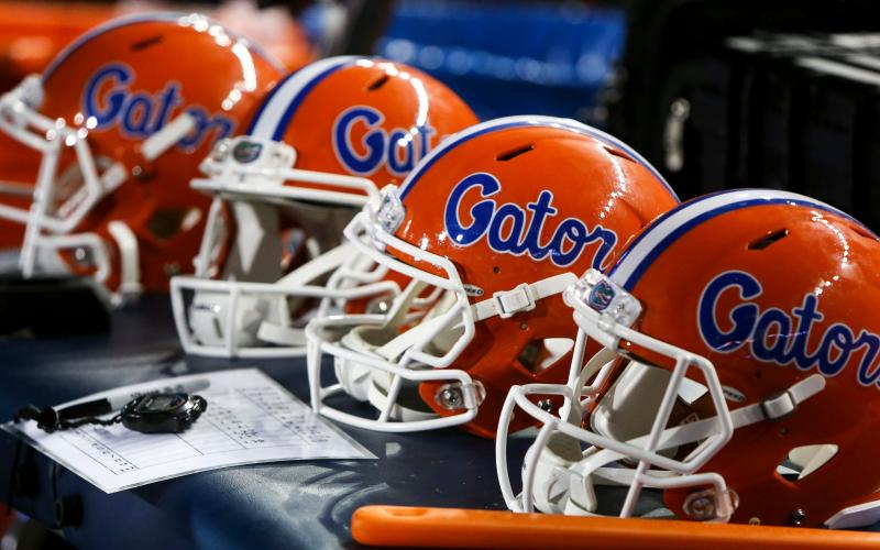 Florida Gators helmets sit on a table during a game against Charleston Southern on Sept. 1, 2018 at Ben Hill Griffin Stadium in Gainesville. (TRIBUNE NEWS SERVICE)
