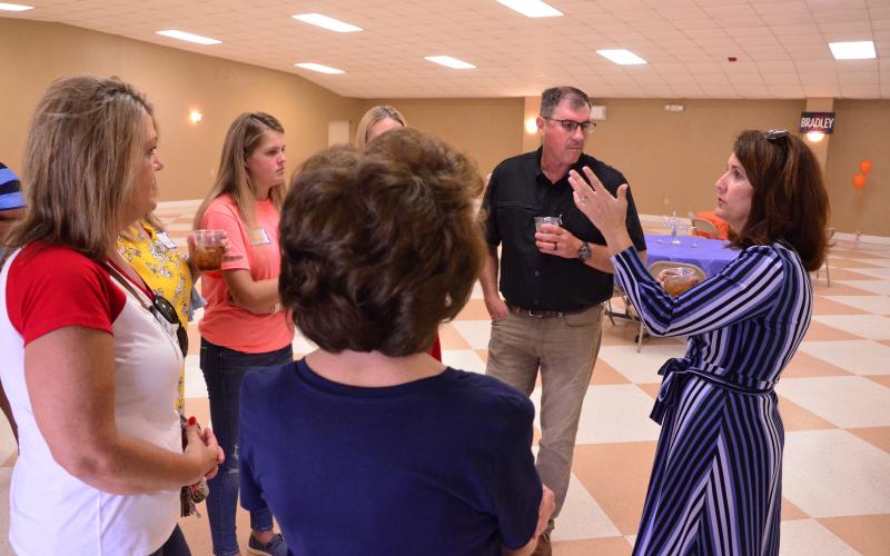 State Senate candidate Jennifer Bradley chats with a group during a meet and greet at the Columbia County Fairgrounds on Thursday. Bradley, a Republican, is running for the District 5 Senate seat held by her soon-to-be term-limited husband. (CARL MCKINNEY/Lake City Reporter)