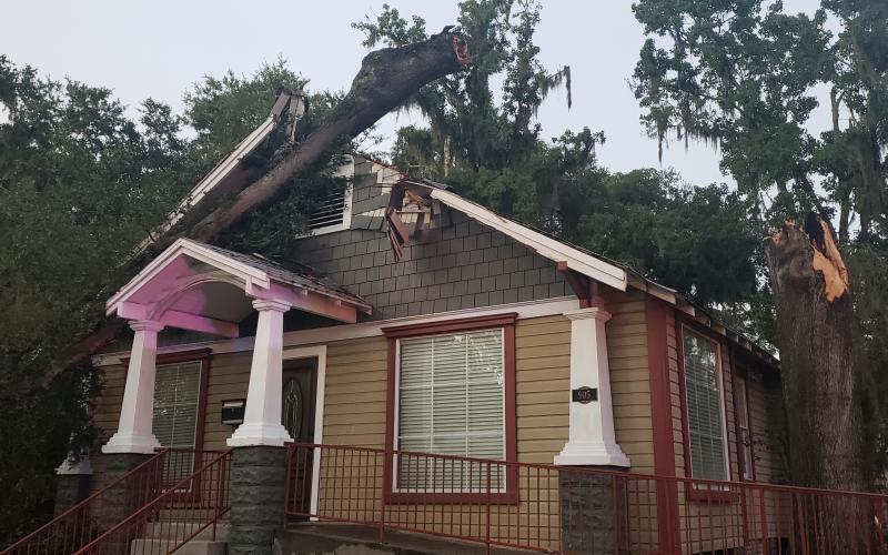 Part of a tree fell on the law office of Lloyd and Sandra Peterson on Baya Avenue after being struck by lightning during a thunderstorm Monday evening. (Courtesy LAKE CITY POLICE DEPARTMENT)