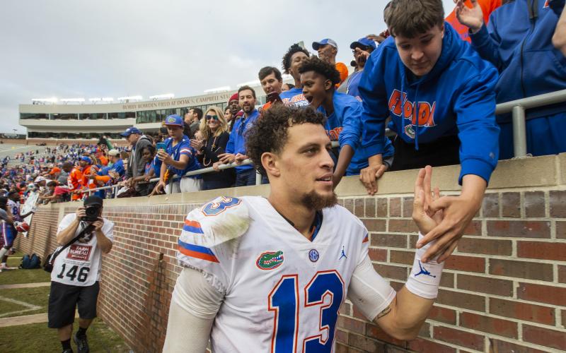 Florida quarterback Feleipe Franks (13) gets congratulated by fans after defeating Florida State 41-14 on Nov. 24, 2018, in Tallahassee. (AP FILE PHOTO)