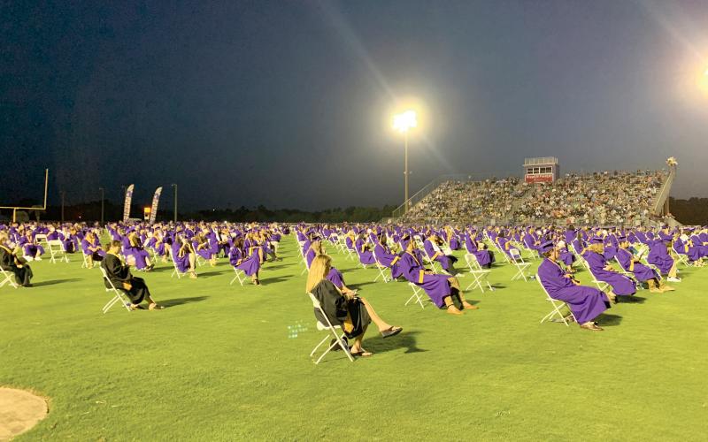 The Columbia High Class of 2020 complied with social distancing, sitting 6 feet apart Saturday night for commencement and some students didn’t attend. (RAY CARPENTER/Lake City Reporter)