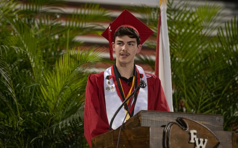 Calvin Hencin, Fort White’s Class of 2020 Valedictorian, speaks Friday night during the graduation ceremony. (RAY CARPENTER/Lake City Reporter)