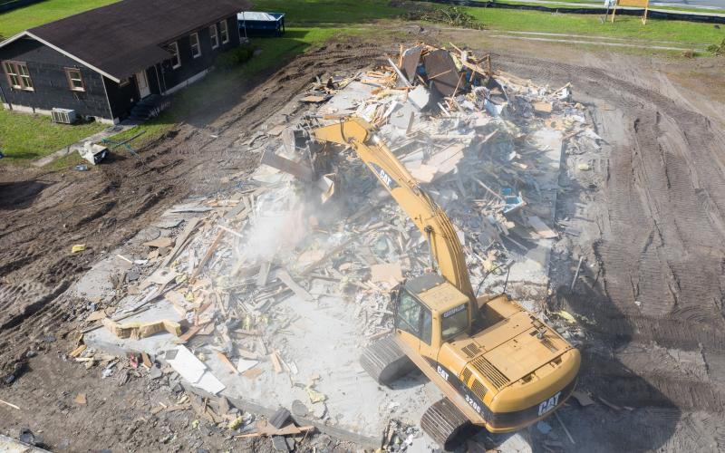 Construction crews worked Thursday on demolishing the former site of Hopeful Baptist West on U.S. Highway 90. The site will be the future home of an O’Reilly Auto Parts store. (Courtesy RAY CARPENTER PHOTOGRAPHY)