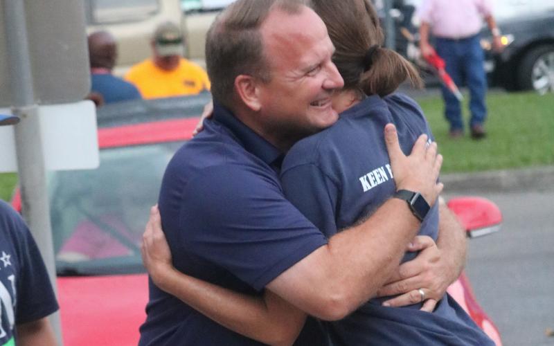Kyle Keen hugs his wife, Brandi, Tuesday night outside the Supervisor of Elections office after winning the Tax Collector’s primary race. With the win, Keen advances to November’s general election. (JAMIE WACHTER/Lake City Reporter)