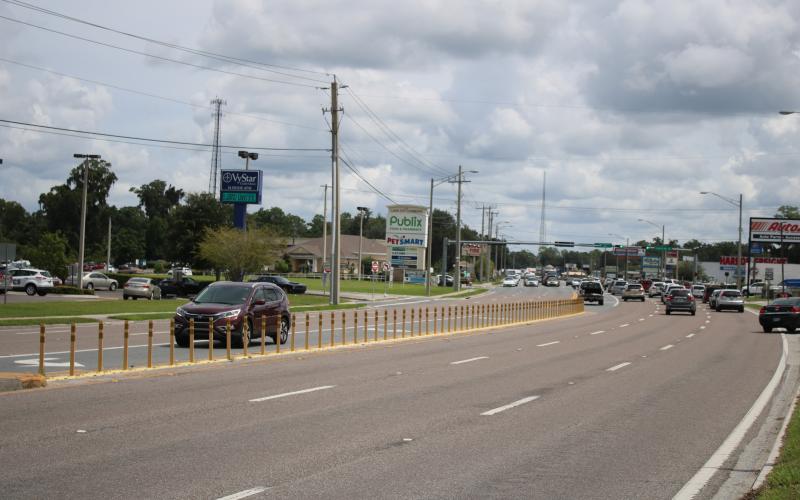 The Florida Department of Transportation will soon replace the traffic delineators near the Lake City Commons shopping center with a raised median. (TONY BRITT/Lake City Reporter)