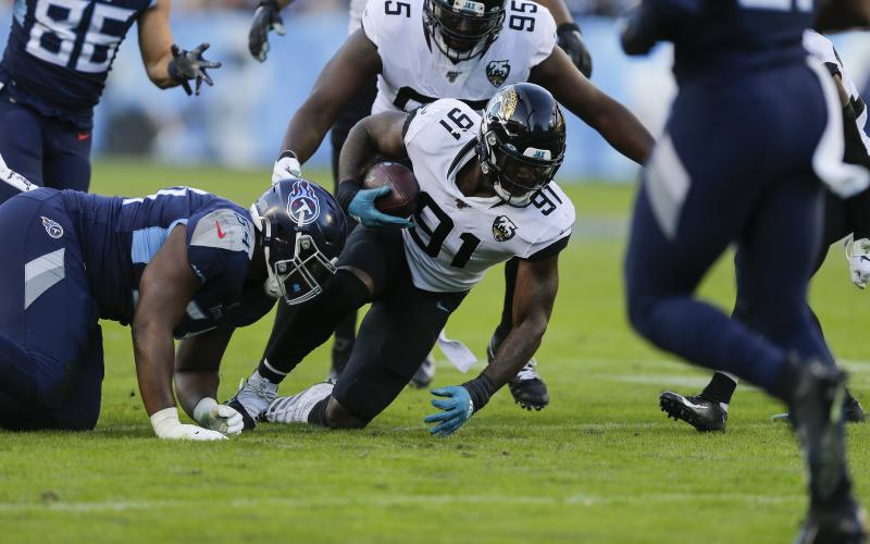 Jacksonville Jaguars defensive end Yannick Ngakoue (91) gets control of a fumble by the Tennessee Titans on Nov. 24, 2019 at Nissan Stadium in Nashville, Tennessee. The Minnesota Vikings sent a 2021 second-round pick and a conditional 2022 fifth-rounder to Jacksonville in a trade for Ngakoue. (SILA WALKER/Getty Images/TNS)