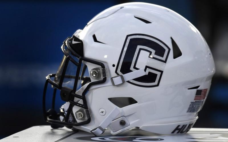 A Connecticut football helmet rests on the sideline during an NCAA college football game on Sept. 7, 2019, in East Hartford, Conn. UConn has canceled its 2020-2021 football season, becoming the first FBS program to suspend football because of the coronavirus pandemic. (AP FILE PHOTO)