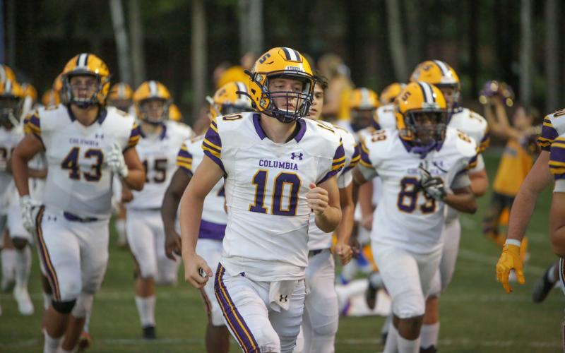 Columbia quarterback Kade Jackson jogs out onto the field prior to Friday’s game against Trinity Christian. (BRENT KUYKENDALL/Lake City Reporter)