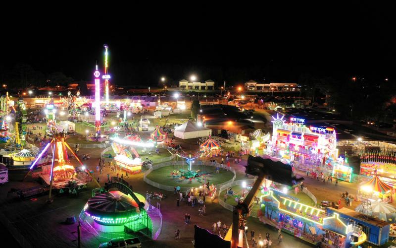 The Florida Gateway Fairgrounds were aglow last year by the midway at the Florida Gateway Fair, which will return next month. The fair, with additional safety measures in place, is scheduled for Oct. 30 through Nov. 7. (RAY CARPENTER PHOTOGRAPHY FILE)