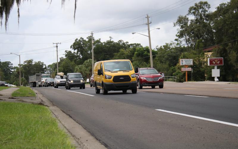 Vehicles travel east on US Highway 90 near the intersection of Northwest McFarlane Avenue Monday afternoon. The DOT started a $6.4 million resurfacing project on the roadway Sunday night. (TONY BRITT/Lake City Reporter)
