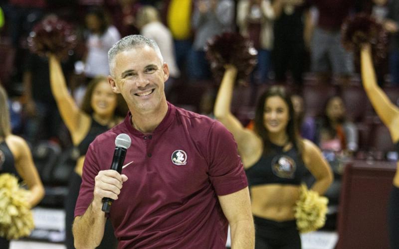 Florida State’s new head coach Mike Norvell smiles after being introduced during halftime of a basketball game against Clemson on Dec. 8, 2019, in Tallahassee. (AP FILE PHOTO)