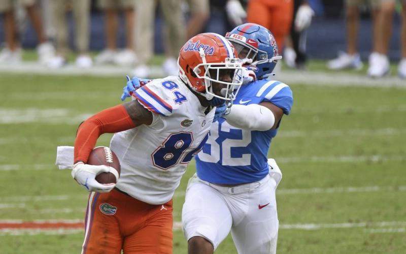 Florida tight end Kyle Pitts (84) breaks away from Mississippi linebacker Jacquez Jones (32) on Saturday, in Oxford, Miss. No. 5 Florida won 51-35. (THOMAS GRANING/Associated Press)