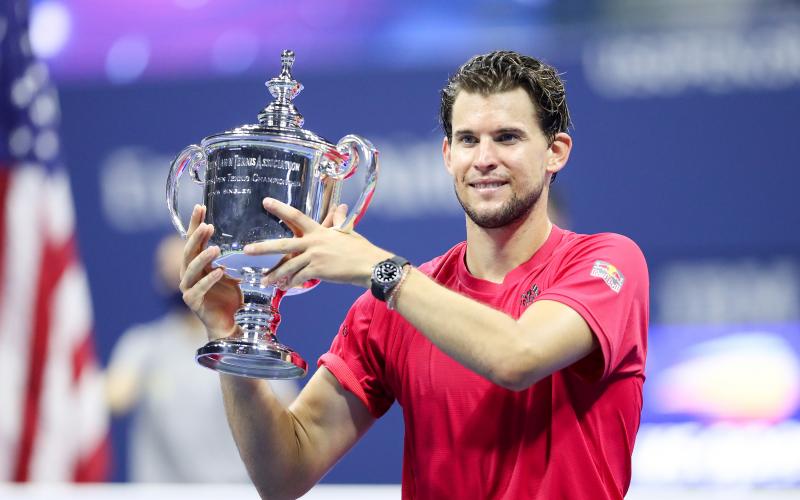 Dominic Thiem celebrates with the championship trophy after winning in a tie-breaker during his Men's Singles final match against Alexander Zverev on Day 14 of the 2020 U.S. Open at the USTA Billie Jean King National Tennis Center on Sunday, in the Queens borough of New York City. (MATTHEW STOCKMAN/Getty Images/TNS)